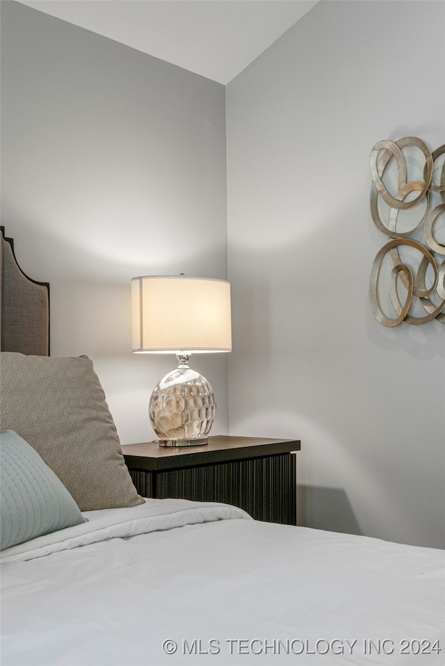 bedroom with lofted ceiling