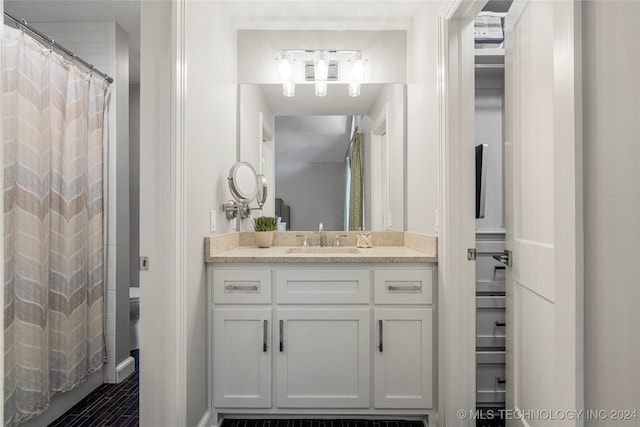 bathroom with vanity, a shower with curtain, and toilet