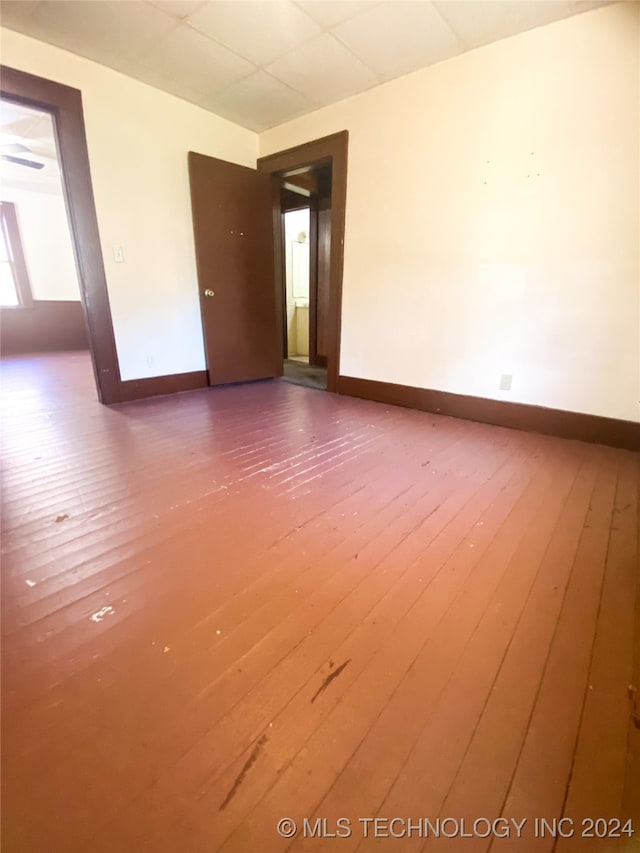 empty room with hardwood / wood-style flooring