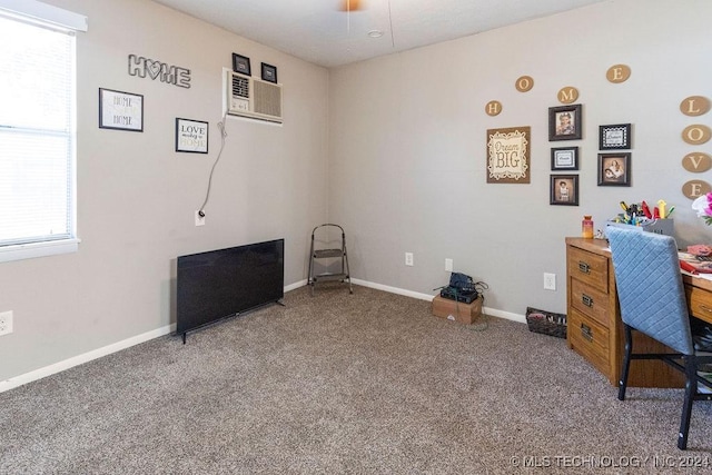 home office featuring carpet flooring, baseboards, and a wall mounted AC