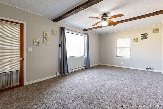 carpeted empty room featuring a ceiling fan, a healthy amount of sunlight, crown molding, and a textured ceiling