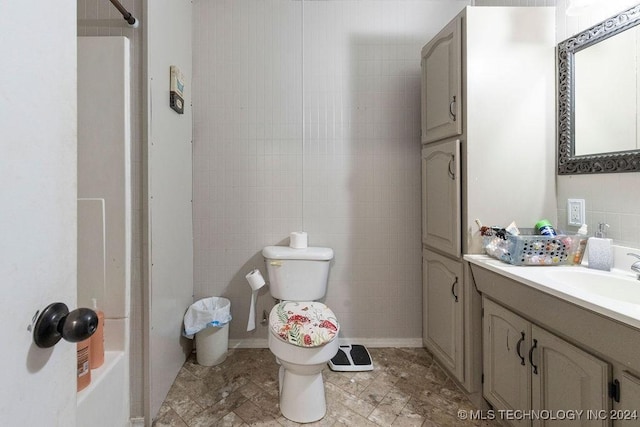 bathroom featuring toilet and vanity