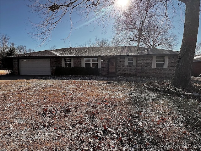 ranch-style home featuring a garage