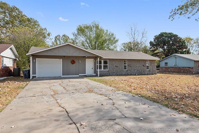 ranch-style house featuring a garage