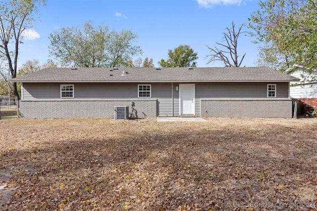 back of house with central air condition unit and a patio area