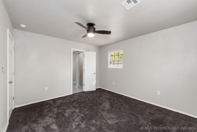 unfurnished bedroom with ceiling fan and carpet