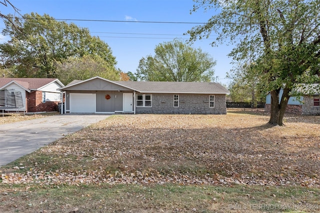 single story home featuring a garage