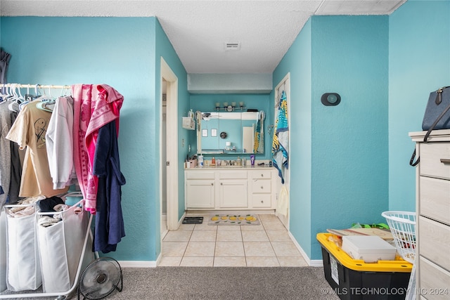 bathroom featuring vanity and tile patterned flooring