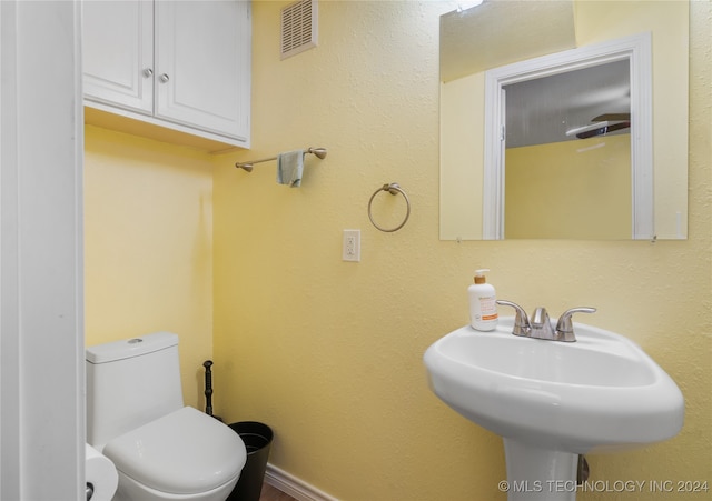 bathroom with sink and toilet