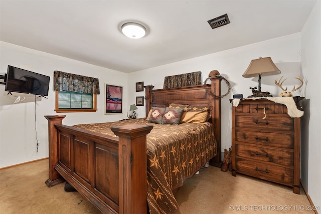 bedroom with light colored carpet