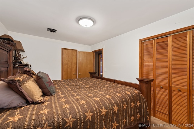 bedroom featuring a closet and carpet