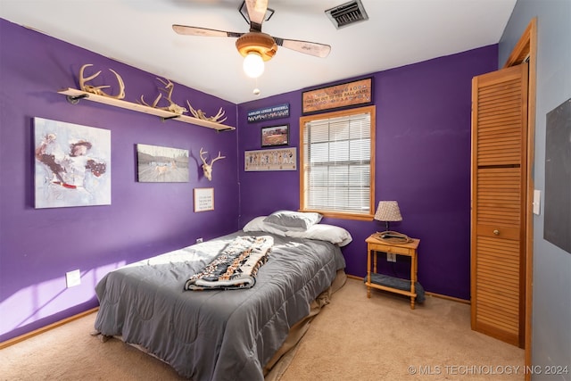 carpeted bedroom featuring ceiling fan