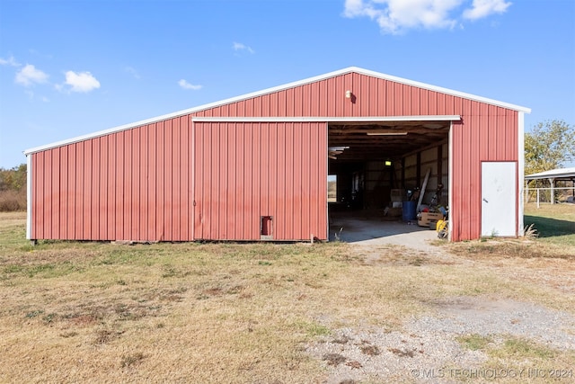 view of outdoor structure featuring a lawn