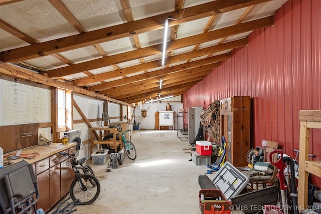 misc room with a workshop area and vaulted ceiling