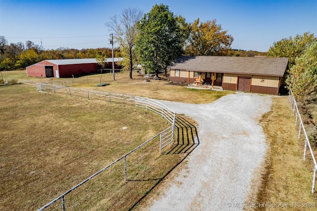 exterior space with a rural view and an outbuilding