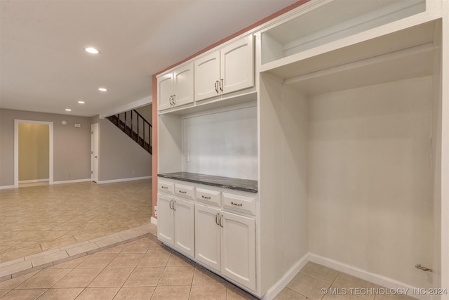 kitchen with white cabinets and light tile patterned flooring