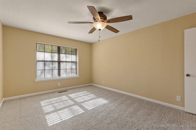 carpeted empty room with ceiling fan