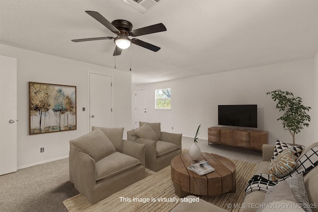 living room featuring ceiling fan and light colored carpet