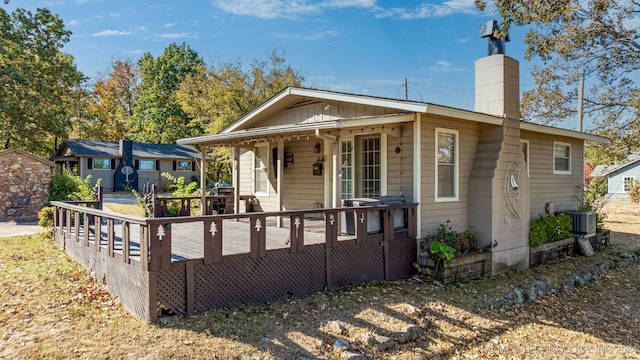 back of house featuring a deck and central AC unit