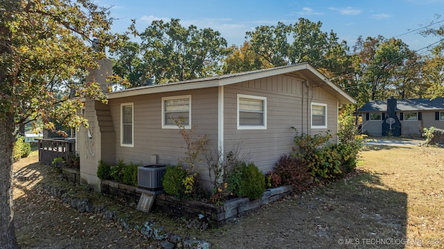 view of side of property with central AC unit