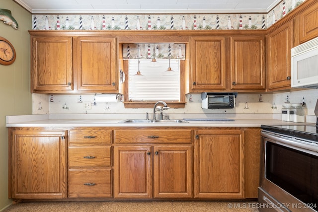 kitchen featuring sink and electric stove