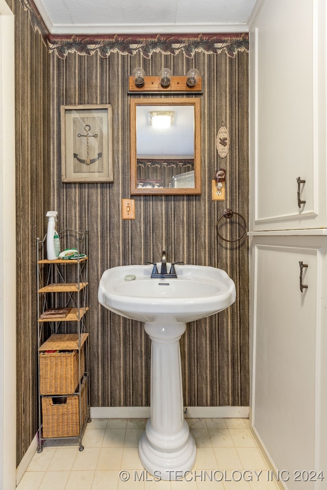 bathroom featuring tile patterned flooring and sink