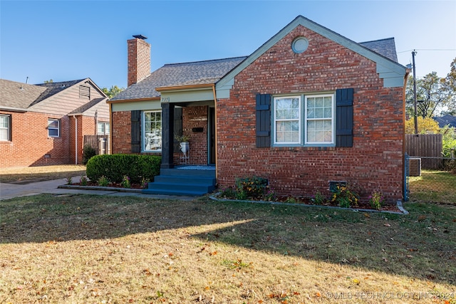 view of front of home with a front yard