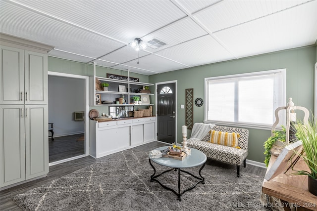 sitting room with dark hardwood / wood-style flooring