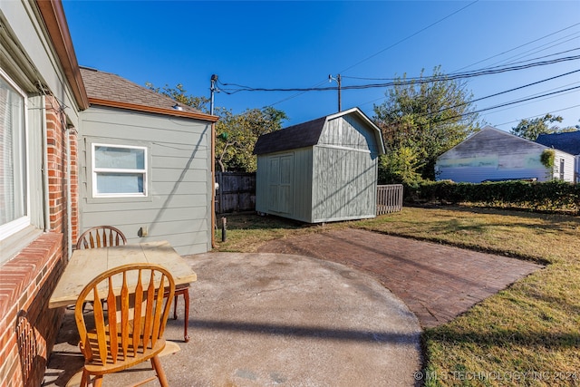 view of patio featuring a shed