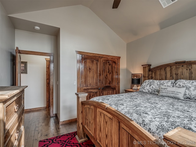 bedroom featuring hardwood / wood-style floors, ceiling fan, and vaulted ceiling