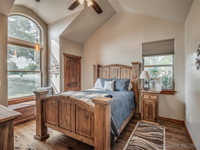 bedroom with ceiling fan, hardwood / wood-style flooring, high vaulted ceiling, and multiple windows