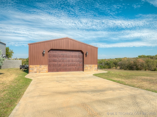 garage featuring a yard