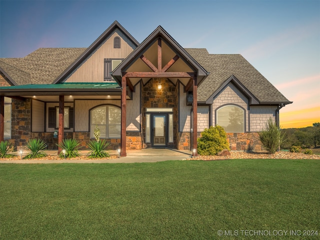 view of front of house with a yard