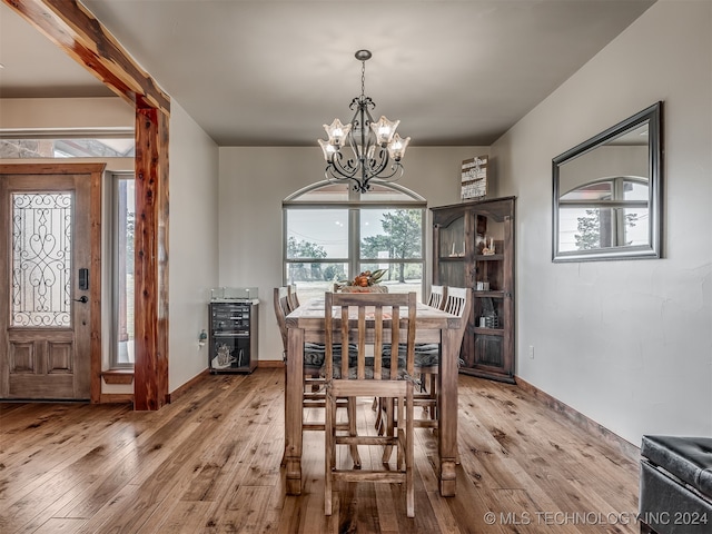 dining space featuring a chandelier and hardwood / wood-style flooring