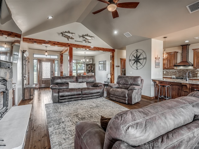 living room with lofted ceiling, sink, ceiling fan with notable chandelier, and dark hardwood / wood-style flooring