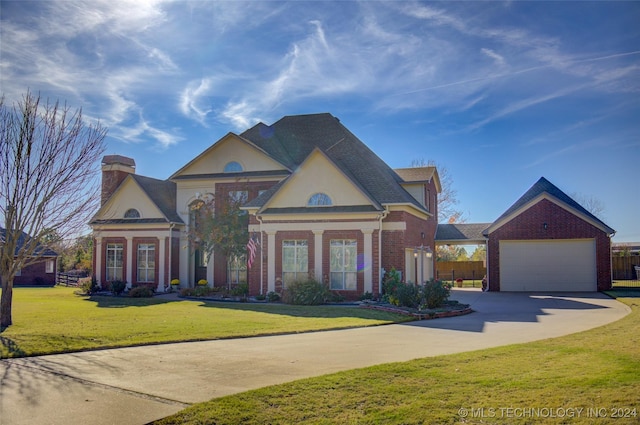 view of front of house featuring a front lawn and a garage