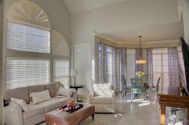 living room with light tile patterned floors and ornamental molding