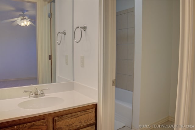 bathroom with ceiling fan and vanity