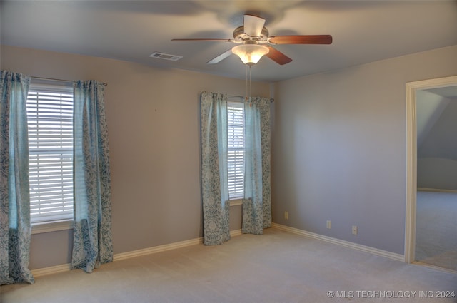 carpeted empty room with ceiling fan