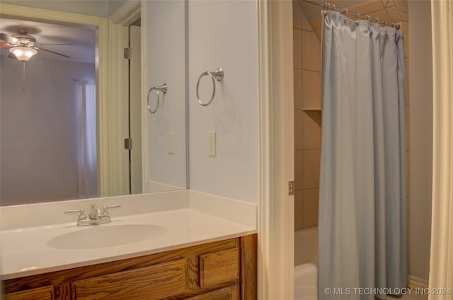 bathroom with ceiling fan, shower / tub combo, and vanity