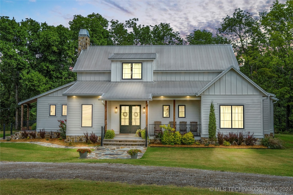 view of front of property with a yard and a porch