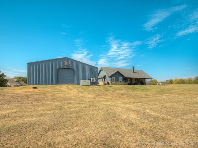 exterior space featuring a yard and a garage