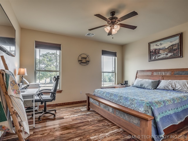 bedroom featuring hardwood / wood-style floors and ceiling fan