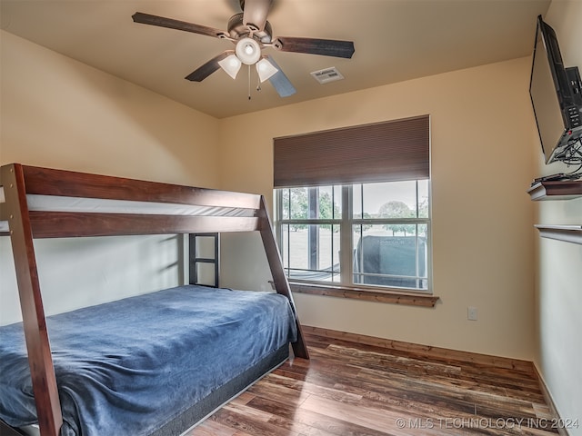 bedroom featuring dark hardwood / wood-style floors and ceiling fan