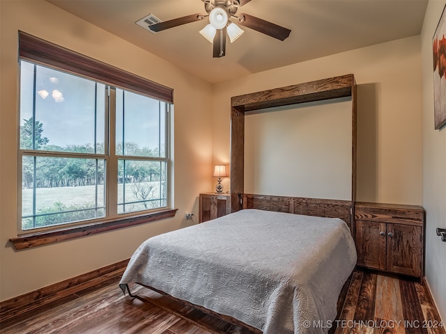 bedroom featuring hardwood / wood-style floors and ceiling fan