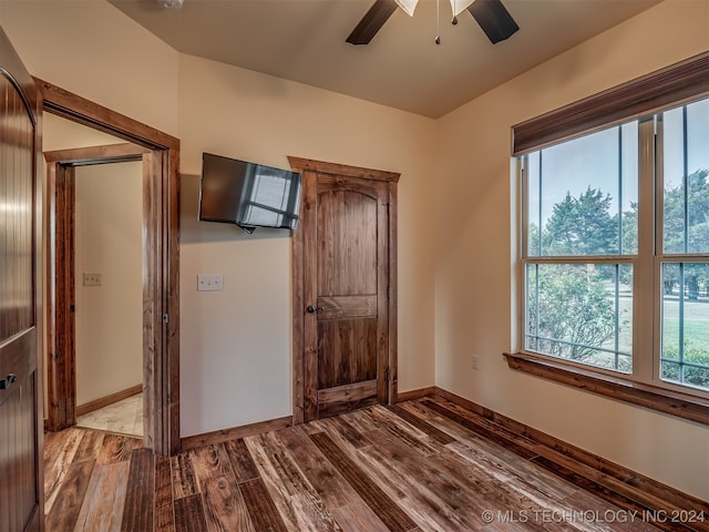 unfurnished bedroom with light hardwood / wood-style floors and ceiling fan