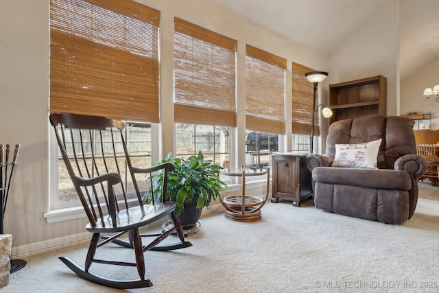 living area featuring lofted ceiling and light carpet