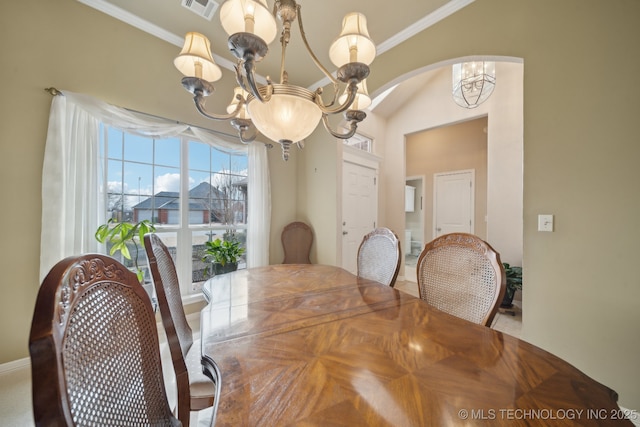 dining area with a notable chandelier and ornamental molding