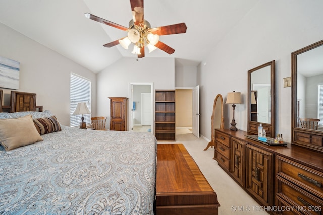 bedroom featuring vaulted ceiling and light carpet