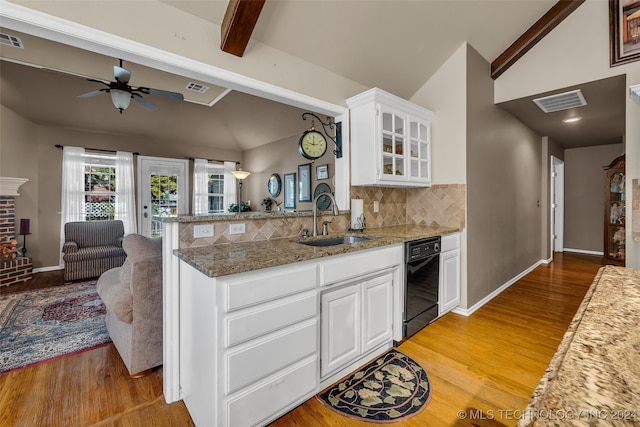 kitchen with backsplash, sink, vaulted ceiling with beams, white cabinetry, and kitchen peninsula